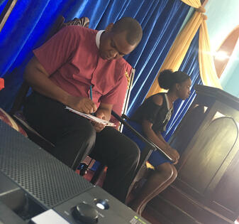 (Left to right) Reverend Adrian Dunn, Pastor and Brianna Frater, Youth Vice President